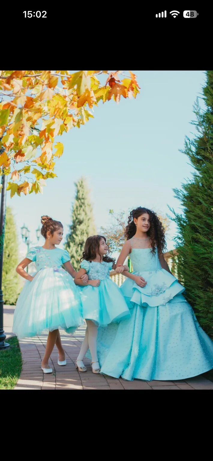 Three turquoise occasion dresses