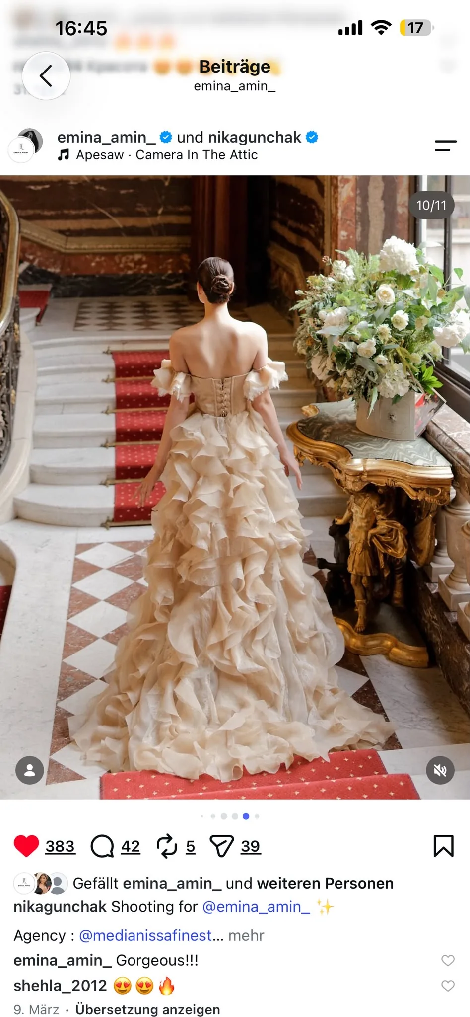 Back view of an ivory ruffled gown and its long train