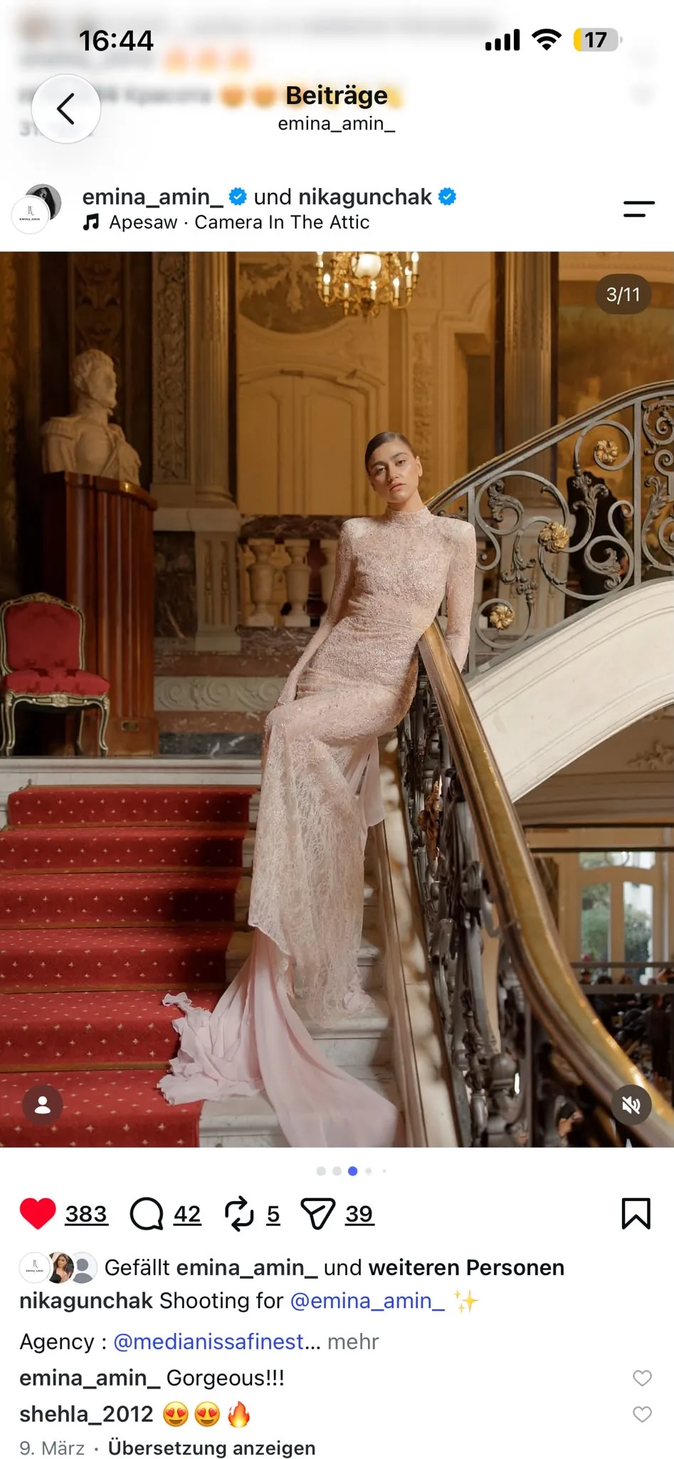Blush embellished gown with a satin train on the staircase